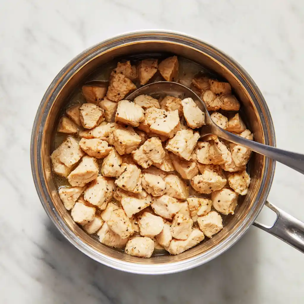 Browning chicken cubes with the Tuscan flavor base for Weight Watchers Tuscan Chicken Pasta