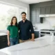 Nora and Nicolas Dalim smiling in their kitchen, creators of My Recipes Made family food blog